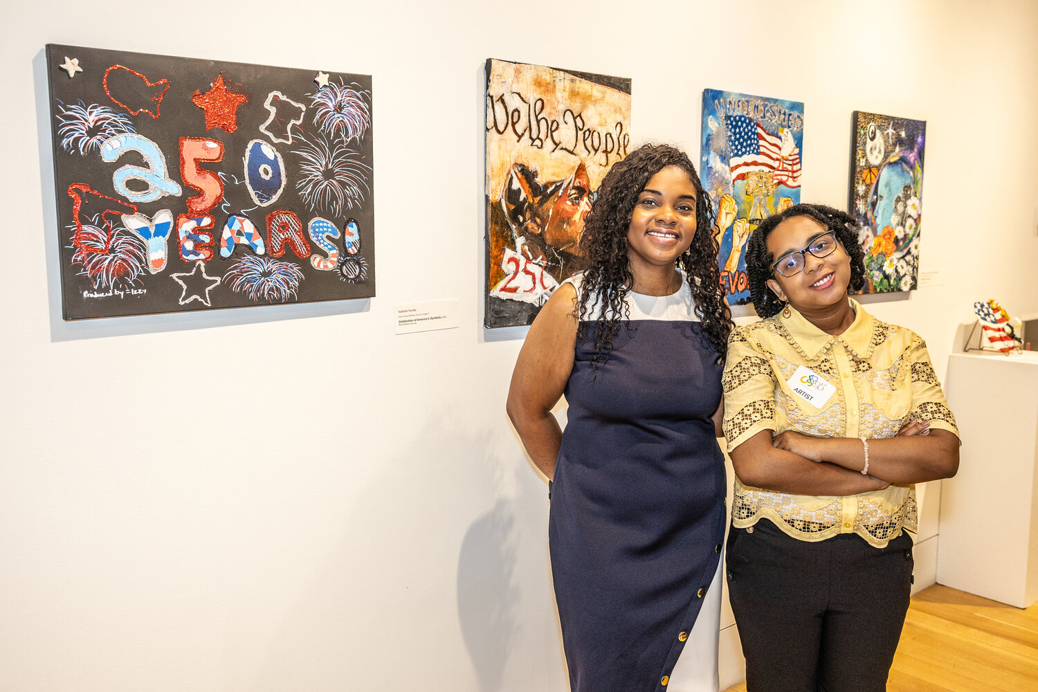 Artist Isabella Hunter and her teacher pose with ​