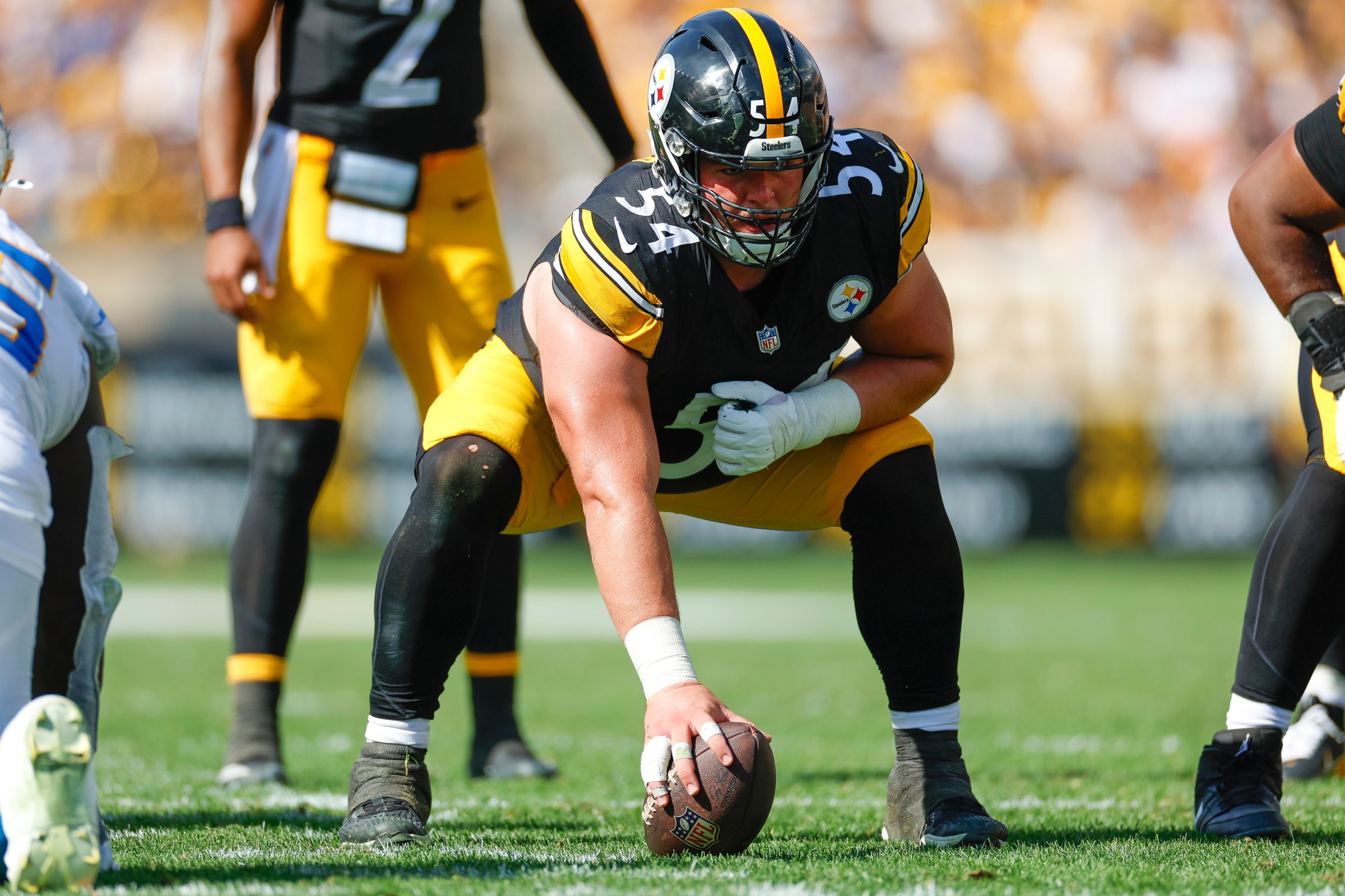 Zach Frazier #54 of the Pittsburgh Steelers lines up on the line of scrimmage during the fourth quarter against the Los Angeles Chargers at Acrisure Stadium on September 22, 2024 in Pittsburgh, Pennsylvania.