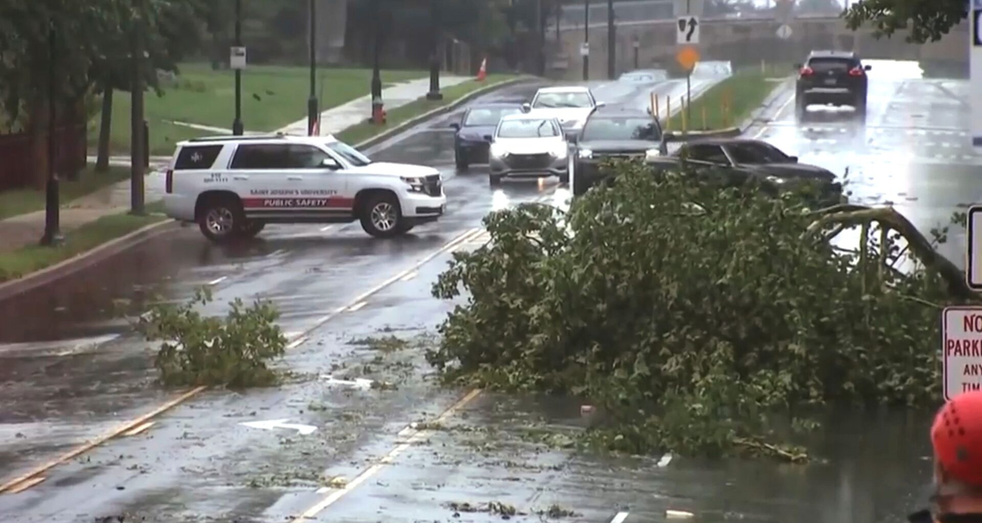 This image taken from video shows a broken tree branch on a street, Sunday, July 12, 2026 after a line of severe, short thunderstorms passed through the city the day before in Philadelphia. (WPVI-TV/6ABC via AP)