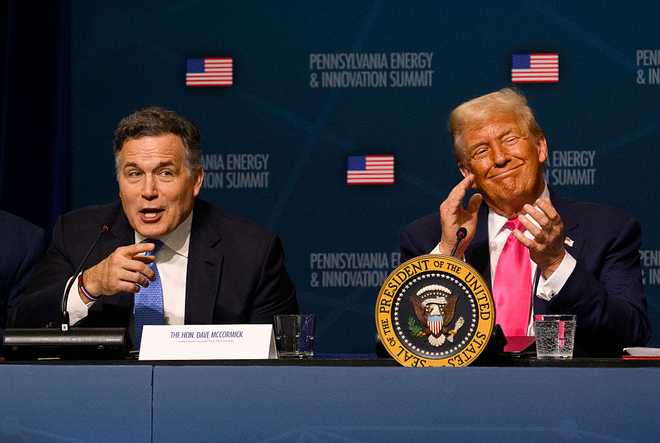 President Trump Speaks At Inaugural Pennsylvania Energy And Innovation Summit PITTSBURGH, PENNSYLVANIA - JULY 15: U.S. President Donald Trump (R) reacts as U.S. Sen. Dave McCormick (R-PA) speaks during the inaugural Pennsylvania Energy and Innovation Summit at Carnegie Mellon University on July 15, 2025 in Pittsburgh, Pennsylvania. U.S. President Donald Trump, joined by leading technology and energy companies, announced more than $90 billion in energy and technology investments in the state. (Photo by Jeff Swensen/Getty Images)