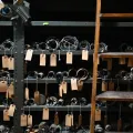 Rolls of maps with hand written tags hanging over shelves.