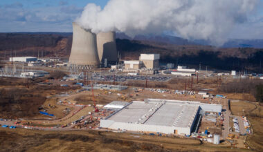 FILE - A data center owned by Amazon Web Services, front right, is under construction next to the Susquehanna nuclear power plant in Berwick, Pa., Jan. 14, 2025. (AP Photo/Ted Shaffrey, File)