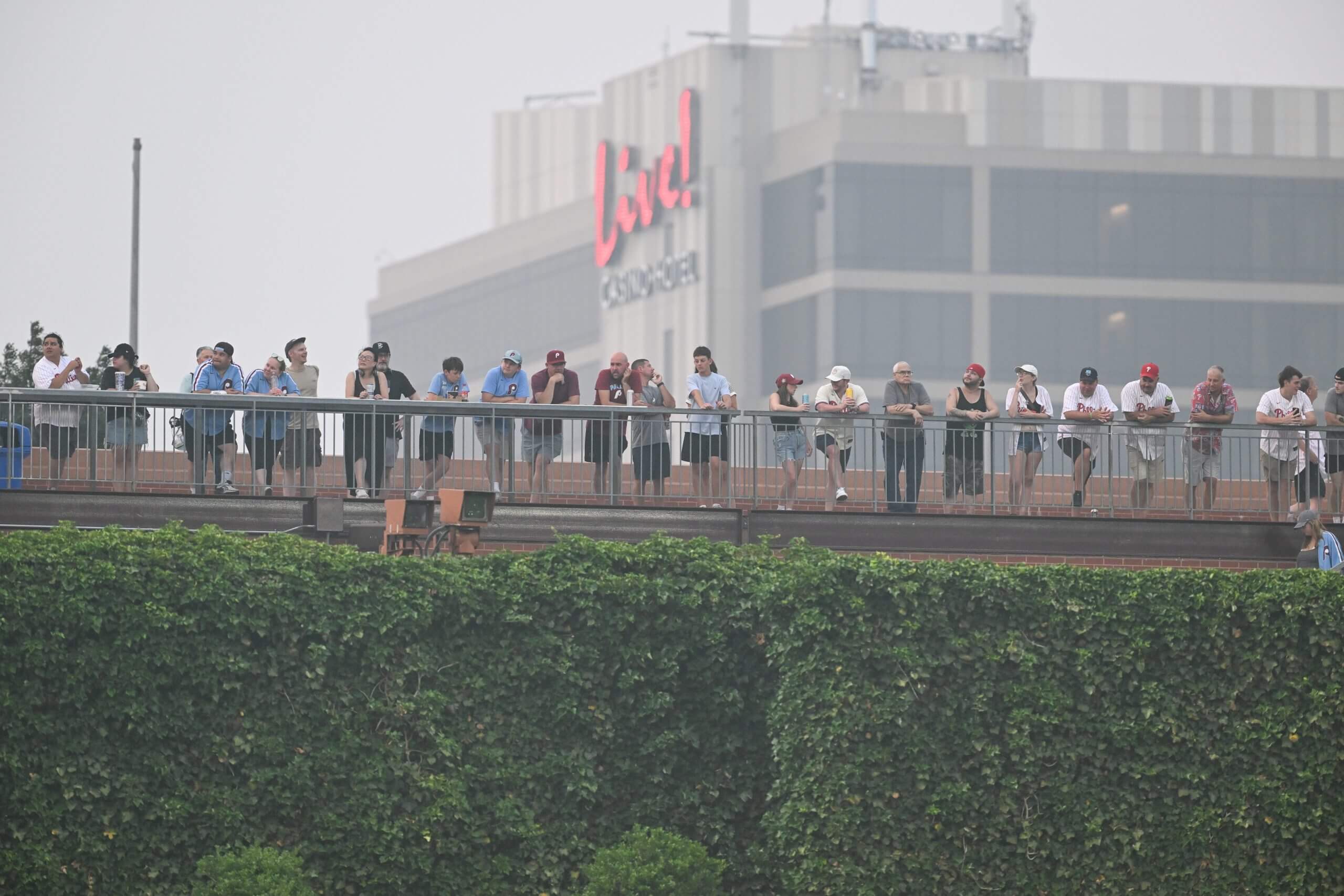 Fans line the outfield bleachers at Citizens Bank Park in Philadelphia amid hazy conditions. 