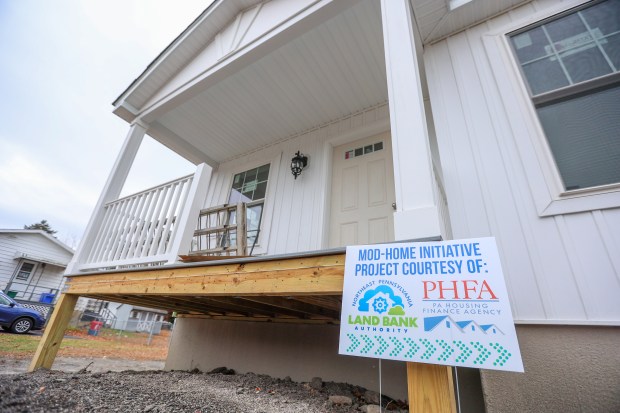 The exterior of a mod home on display during a groundbreaking ceremony celebrating the Northeast Pennsylvania Land Bank's Mod-Home Initiative Project in Dupont on Wednesday, Nov. 12, 2025. (JASON ARDAN / STAFF PHOTOGRAPHER)