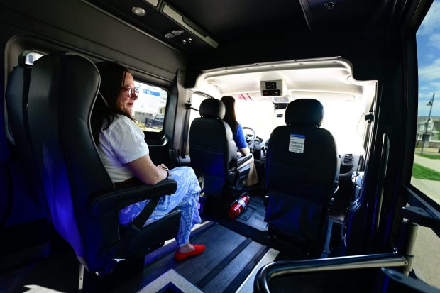 Erie Town Councilmember Emily Baer, left, looks out the window while riding the Erie Bee in June. (Matthew Jonas/Staff Photographer)