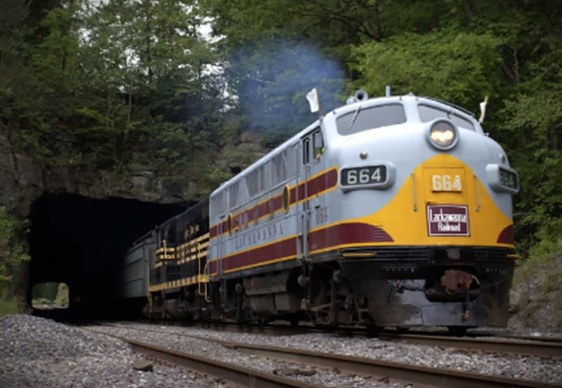 A deisel locomotive exits a train tunnel at Steamtown National Historic Site in Scranton, PA.