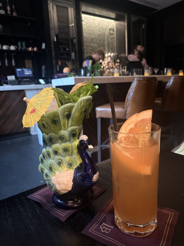 A expertly crafted cocktail and a mocktail in The Library Bar at The Rittenhouse Hotel. In addition to its cocktails, rare spirits and extensive wine list, the Library Bar is known for its upscale, club-like atmosphere with leather chairs, a fireplace and a curated book collection. (PEG DEGRASSA/ DAILY TIMES)