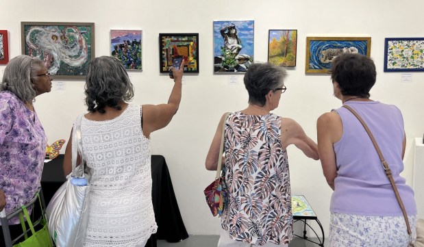 Visitors at Delaware County Community College's Art Gallery in Marple Township are enjoying the Senior Community Services' exhibition featuring works by local seniors who belong to the SCS Delaware County senior centers. The show continues until Friday, July 31. (COURTESY OF SCS)