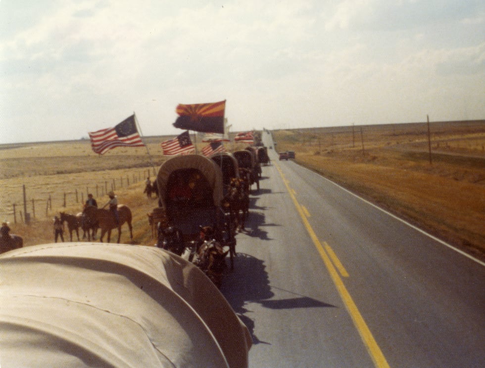 Wagon train moving down an unknown highway