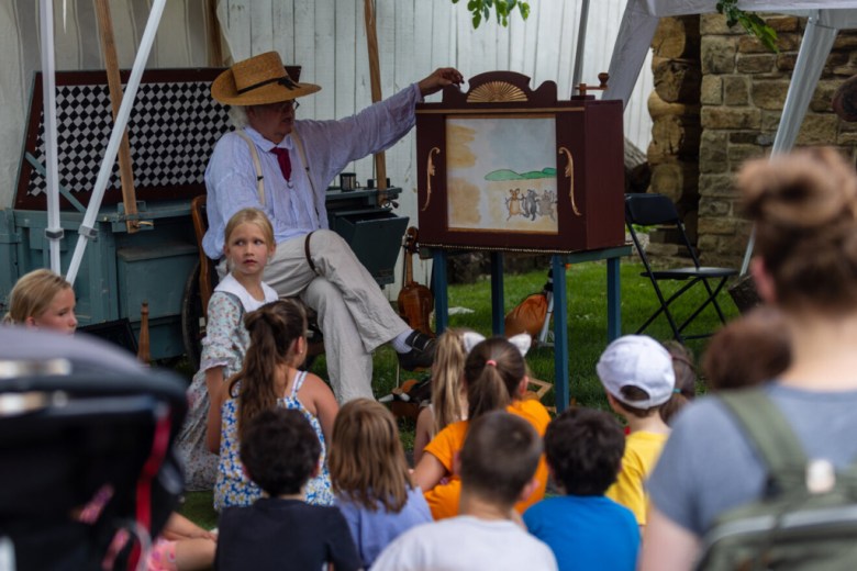 A storyteller entertains kids.