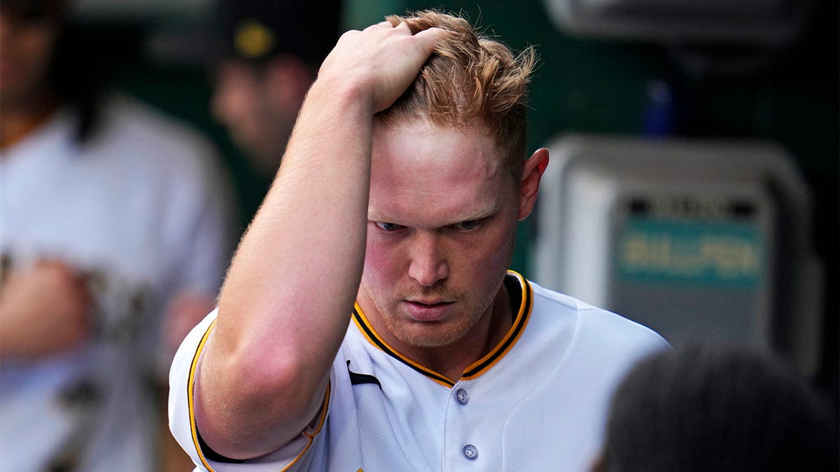 Pittsburgh Pirates starting pitcher Mitch Keller walks in the dugout after pitching in the top of the first inning of a baseball game against the Oakland Athletics in Pittsburgh, Tuesday, June 6, 2023.