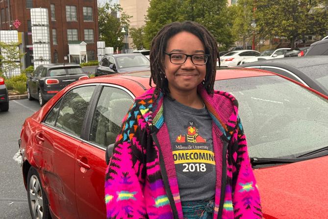 Cierra Mayo stands by her car in Reading