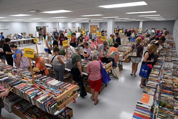 Book lovers crowd one of the rooms during the Book Bonanza at the County of Berks annex in Mohnton on July 10, 2025. (BILL UHRICH/READING EAGLE)