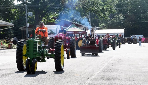 The tractor parade rolls through at the 2025 Schuylkill County Fair. (BILL UHRICH - READING EAGLE)