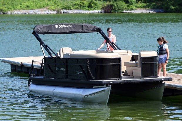 Diane Bianco of Barto prepares to launch her boat Tuesday morning at the Blue Marsh Lake Dry Brooks Boat Launch in Bern Township. She and her husband, Dominic, planned a midweek day on the lake with their granddaughter. (BILL UHRICH - READING EAGLE)