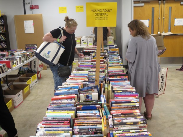Kimberly Patterson (left) and Sarah Westley browse for books during the opening day of the 2026 Berks Book Bonanza. (DAVID MEKEEL - READING EAGLE)