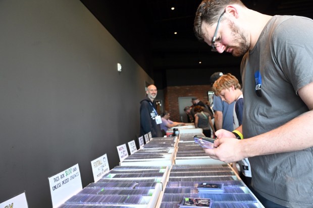 Andrew Salkin of Plymouth Meeting looks through cards during the Pennsylvania State Card Show at the Redner's Event Center at FirstEnergy Stadium on Saturday, July 25, 2026. (BILL UHRICH/READING EAGLE)