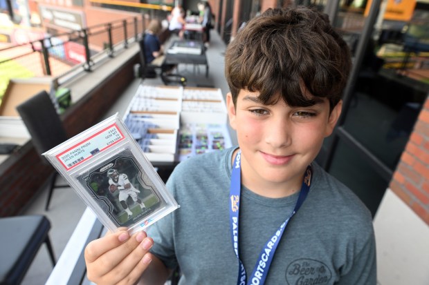 Daniel Grycon of Manheim holds up a Jalen Hurts card he is selling during the Pennsylvania State Card Show at the Redner's Event Center at FirstEnergy Stadium on Saturday, July 25, 2026. (BILL UHRICH/READING EAGLE)