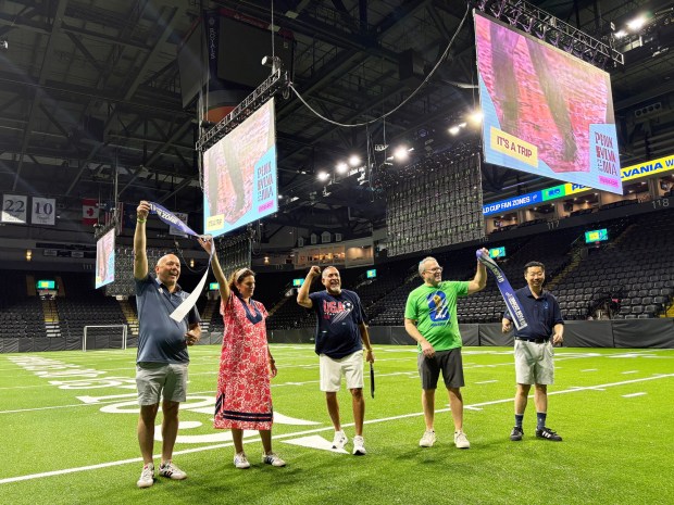 Reading Mayor Eddie Moran cheers after cutting the ribbon to the FIFA Fan Zone Friday at the Santander Arena, a venue where soccer fans can watch World Cup matches. With Moran are from left Bill Gehrman of Philadelphia Soccer 2026; Meg Kane of Philadelphia Soccer 2026; Moran; Berks County Commissioner Dante Santoni; and Garrett Ettinger of Philadelphia Soccer 2026. (BILL UHRICH/READING EAGLE)