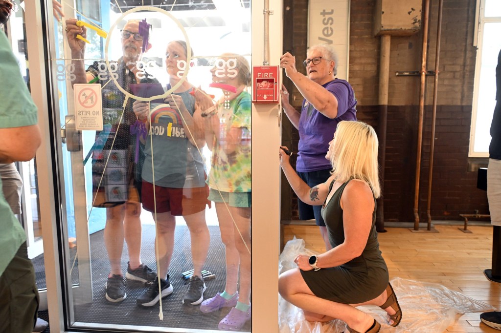 Local churches, LGBT groups join forces to paint Pride mural at GoggleWorks