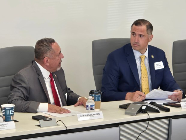 Reading Mayor Eddie Moran (left) and U.S. Department of Housing and Urban Development Assistant Deputy Secretary Joseph DeFelice took part in a roundtable about affordable housing and economic development held in Reading on May 20. (DAVID MEKEEL - READING EAGLE)