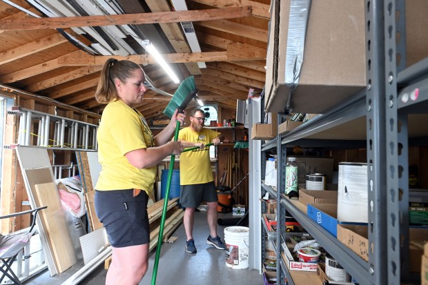 Monica Beistline of Bechtelsville and Pastor Scott Campbell of the Birdsboro Church of the Nazarene assemble brooms in the supply shed at St. Mark's Lutheran Church in Birdsboro during the Mission Trip Birdsboro on Thursday, July 16, 2026. (BILL UHRICH/READING EAGLE)