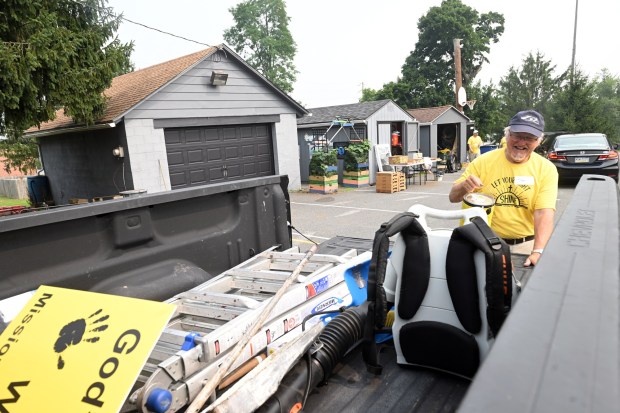 Elmer Miller of Boyertown, a member of St. John's Hill Church, loads his pickup truck with supplies for delivery during the Mission Trip Birdsboro on Thursday, July 16, 2026. (BILL UHRICH/READING EAGLE)