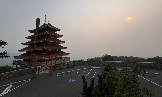 The usually scenic view of downtown Reading from the Pagoda is obscured by haze from Canadian wildfires on Thursday, July 16, 2026. (BILL UHRICH/READING EAGLE)