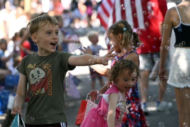 Kids pop bubbles during Wyomissing's Independence Day Parade on Saturday, July 4, 2026. (BILL UHRICH/READING EAGLE)