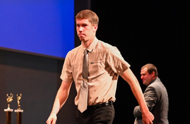 Elk Lake's Kendel Jones receives a medal during the Athlete of the Week Awards Ceremony at Lackawanna College's Peoples Security Bank Theatre in Scranton on Thursday. (SEAN MCKEAG / STAFF PHOTOGRAPHER)