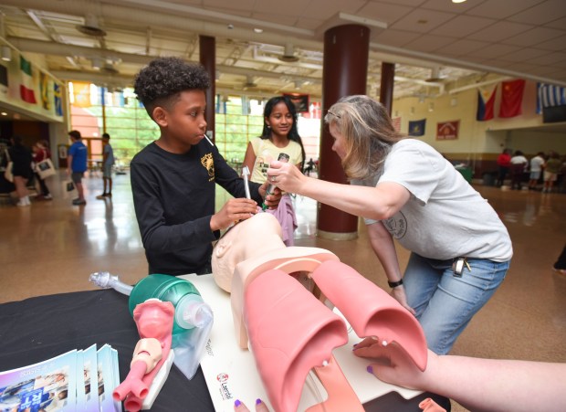 South Scranton Intermediate School student Igor Aguilera learns intubation from Marywood University Respiratory Therapy Program Instructor Jonelle Vinton during the Career Quest Summer Camp at Scranton High School Wednesday, July 29, 2026. (SEAN MCKEAG / STAFF PHOTOGRAPHER)