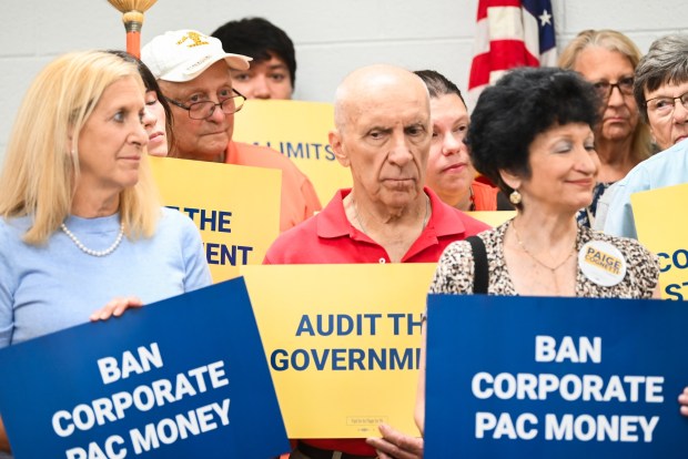 Supporters hold signs during a press conference held by Democratic candidate for Pennsylvania's 8th congressional district Paige Cognetti at the United Association Local Union 524 in Scranton Thursday, July 9, 2026. (SEAN MCKEAG. / STAFF PHOTOGRAPHER)