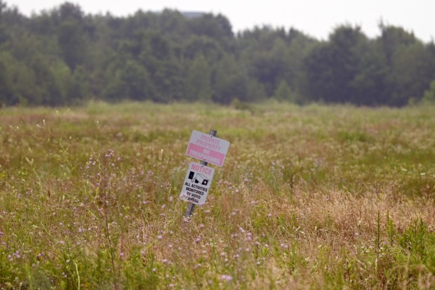 A sign that reads 'Private Property No Trespassing' sticks out of the ground on a parcel of land in Moosic Thursday, July 16, 2026. (SEAN MCKEAG / STAFF PHOTOGRAPHER)