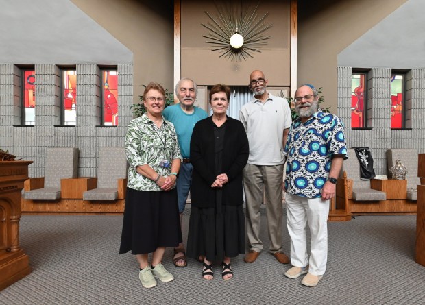 Standing for a photograph in Temple Hesed in Scranton is Sister Donna Korba, IHM, director of Justice, Peace and Integrity of Creation for the Sisters, Servants of the Immaculate Heart of Mary in Scranton, Phil Yevics, secretary of the Scranton Area Multifaith Ministerium, Lee Carr, director of Christian education at Covenant Presbyterian Church in Scranton, Rev. Mark Alexander, pastor of Bethel A.M.E. Church in Scranton and president of the Scranton Area Multifaith Ministerium, and Rabbi Daniel Schwartz, of the Temple Hesed in Scranton. (SEAN MCKEAG / STAFF PHOTOGRAPHER)