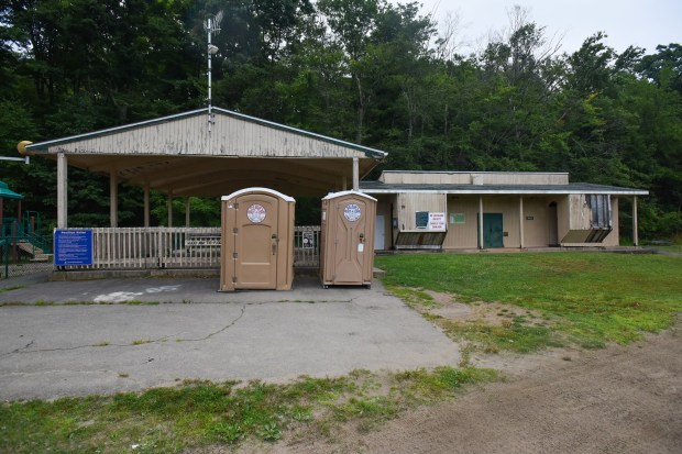 The pavillion and the bath house building at the beach is seen at Merli-Sarnoski Park in Fell Twp. Tuesday, July 21, 2026. (SEAN MCKEAG / STAFF PHOTOGRAPHER)