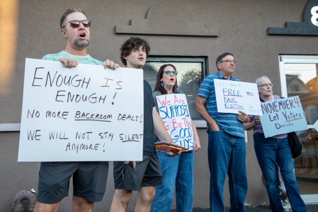 Protestors backing a commissioner special election and pushing for new county Democratic Party leadership chant "let us vote" outside of the Dickson City Community Center on Thursday, Sept. 10, 2025. (REBECCA PARTICKA/STAFF PHOTOGRAPHER)