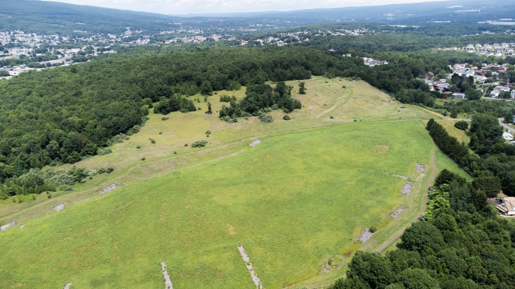 Company buys 101 acres above former Marjol Battery site for housing
