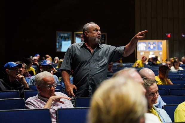 An attendee yells as he is removed for interrupting a public hearing on the proposed Wildcat Ridge Data Center Campus at Valley View High School in Archbald, Pa., on Monday, July 6, 2026. (ISAAC DIAZ/STAFF PHOTO)