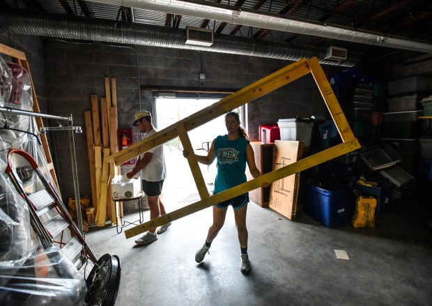 Ashlee Hart, of Sloatsburg, NY, helps clean up the Friends of the Poor & Catherine McAuley Center furniture bank and home good warehouse on Fellows Street in Scranton Wednesday, July 15, 2026. (SEAN MCKEAG / STAFF PHOTOGRAPHER)
