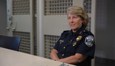 woman in police uniform seated