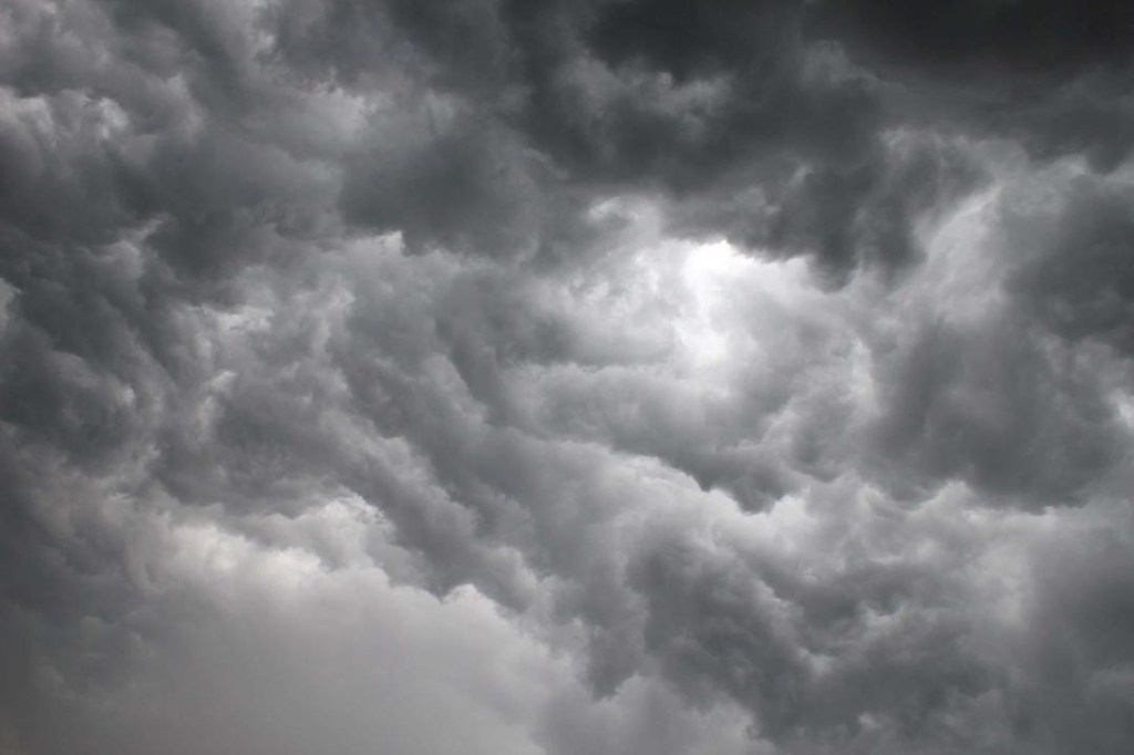 Lightning lit up the sky as more than an inch of rain flooded roads, stranded motorists and knocked out power to thousands across the county.