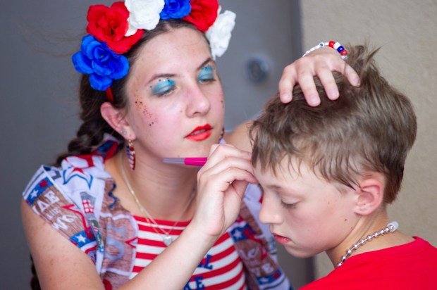 A makeup artist paints a boy's face Friday, July 3, 2026, during the Liberty Ignited celebration marking America's 250th birthday at Coca-Cola Park in Allentown. (Jonathan Broady/Special to The Morning Call)