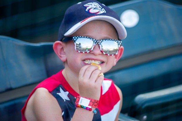 A boy smiles as he enjoys a hot dog Friday, July 3, 2026, during the Liberty Ignited celebration marking America's 250th birthday at Coca-Cola Park in Allentown. (Jonathan Broady/Special to The Morning Call)