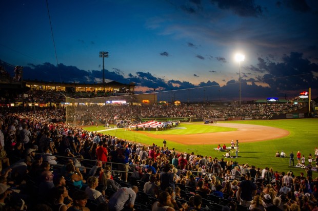 The crowd reacts as a flag is unfurled Friday, July 3, 2026, during the Liberty Ignited celebration marking America's 250th birthday at Coca-Cola Park in Allentown. (Jonathan Broady/Special to The Morning Call)