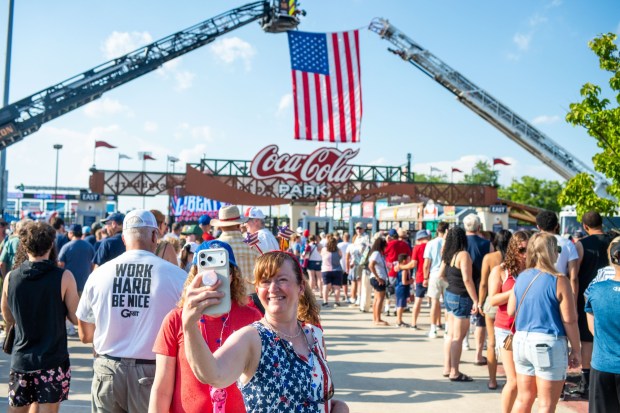 Attendees take a selfie at the entrance to Coca-Cola Park Friday, July 3, 2026, during the Liberty Ignited celebration marking America's 250th birthday in Allentown. (Jonathan Broady/Special to The Morning Call)