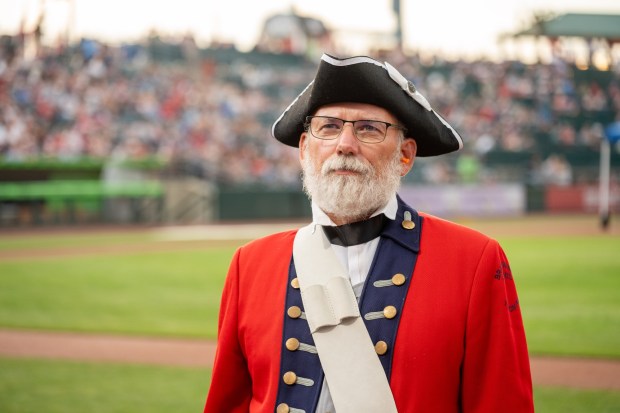 Members of the Bachmann Players perform as a town crier, Benjamin Franklin reads the Declaration of Independence, and Colonial soldiers present a musket salute Friday, July 3, 2026, during the Liberty Ignited celebration marking America's 250th birthday at Coca-Cola Park in Allentown. (Jonathan Broady/Special to The Morning Call)