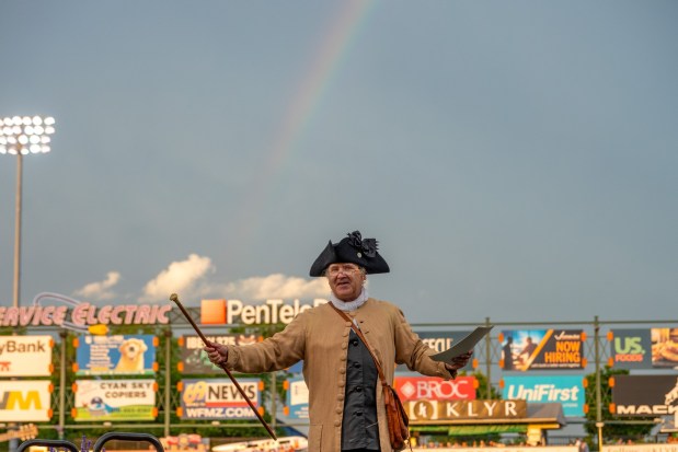 Members of the Bachmann Players perform as a town crier, Benjamin Franklin reads the Declaration of Independence, and Colonial soldiers present a musket salute Friday, July 3, 2026, during the Liberty Ignited celebration marking America's 250th birthday at Coca-Cola Park in Allentown. (Jonathan Broady/Special to The Morning Call)