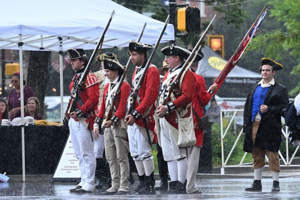Members of 1st Battalion of New Jersey Volunteers reenactment group rehearse in the rain Saturday, July 11, 2026, during the Heritage Day festival in Easton. The festival showcases local and regional history and the heritage of many groups with reenactment events, recreational activities and musical performances. (Jon Chiu/The Morning Call)