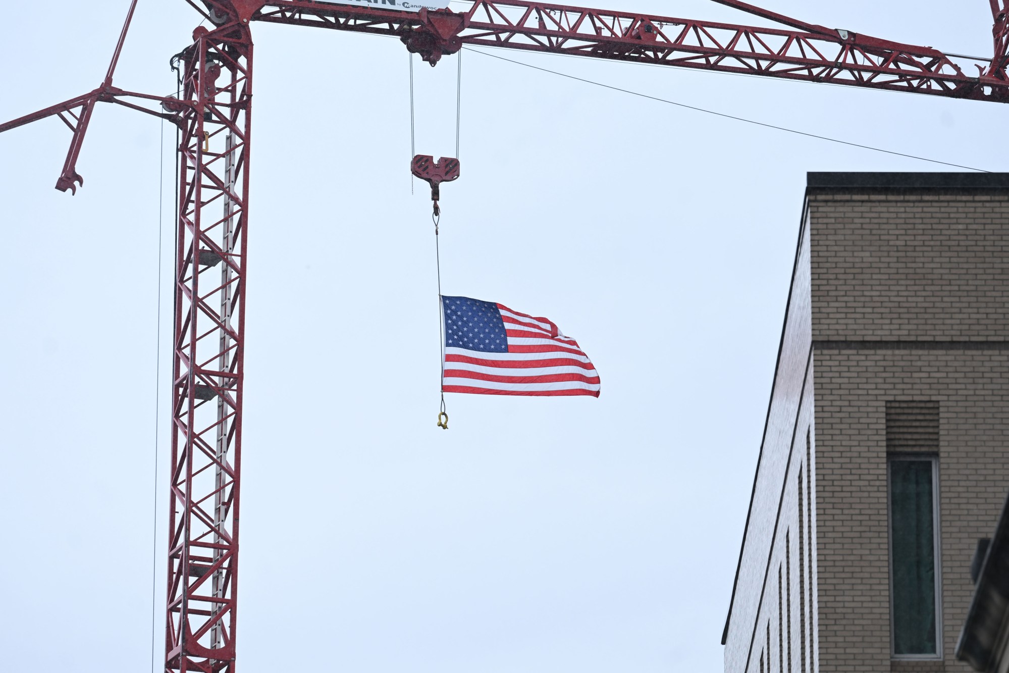 The American flag flies from a crane Saturday, July 11, 2026, during the Heritage Day festival in Easton. The festival showcases local and regional history and the heritage of many groups with reenactment events, recreational activities and musical performances. (Jon Chiu/The Morning Call)