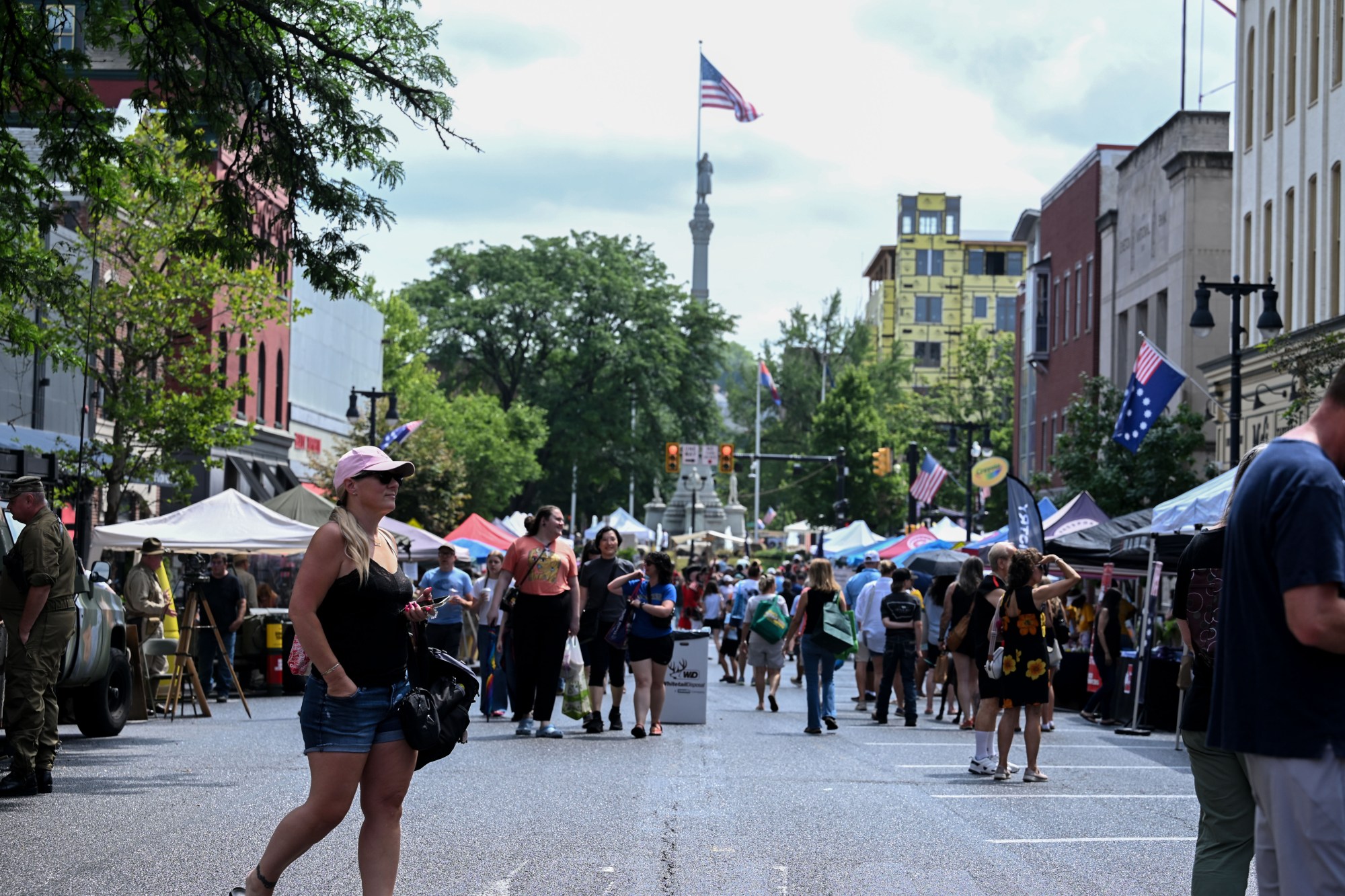 People walk among stands Saturday, July 11, 2026, during the Heritage Day festival in Easton. The festival showcases local and regional history and the heritage of many groups with reenactment events, recreational activities and musical performances. (Jon Chiu/The Morning Call)